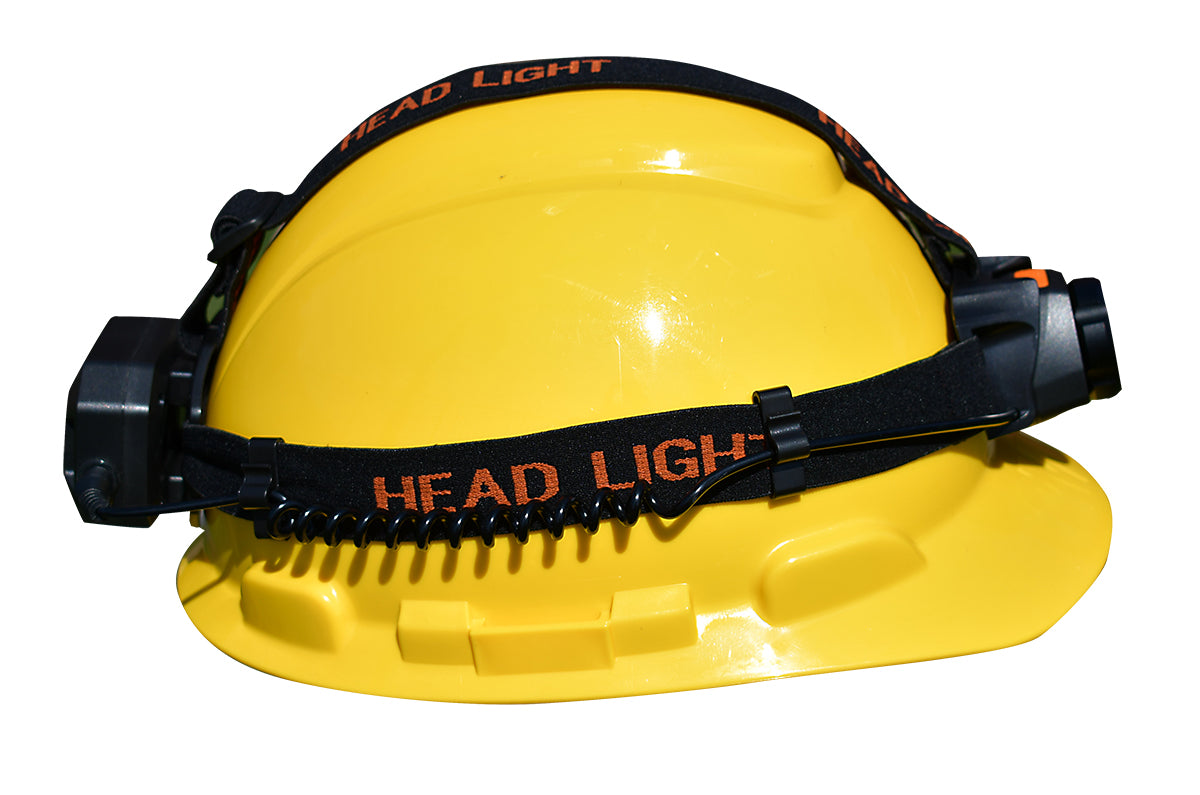 Yellow hard hat with a black headlight on a white background