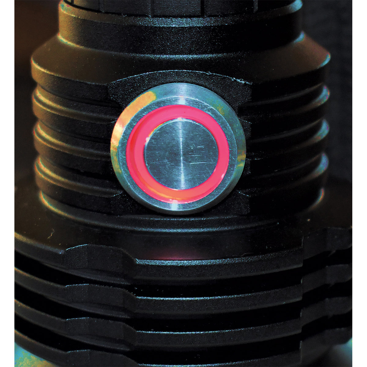 Close-up of a black mechanical component with a colorful ring in the center.