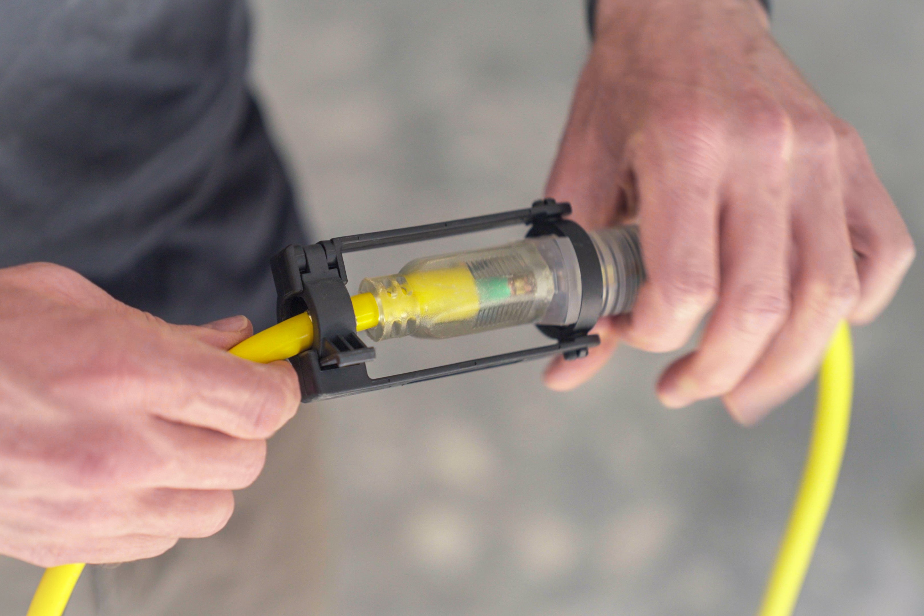 closeup of man holding cords locked